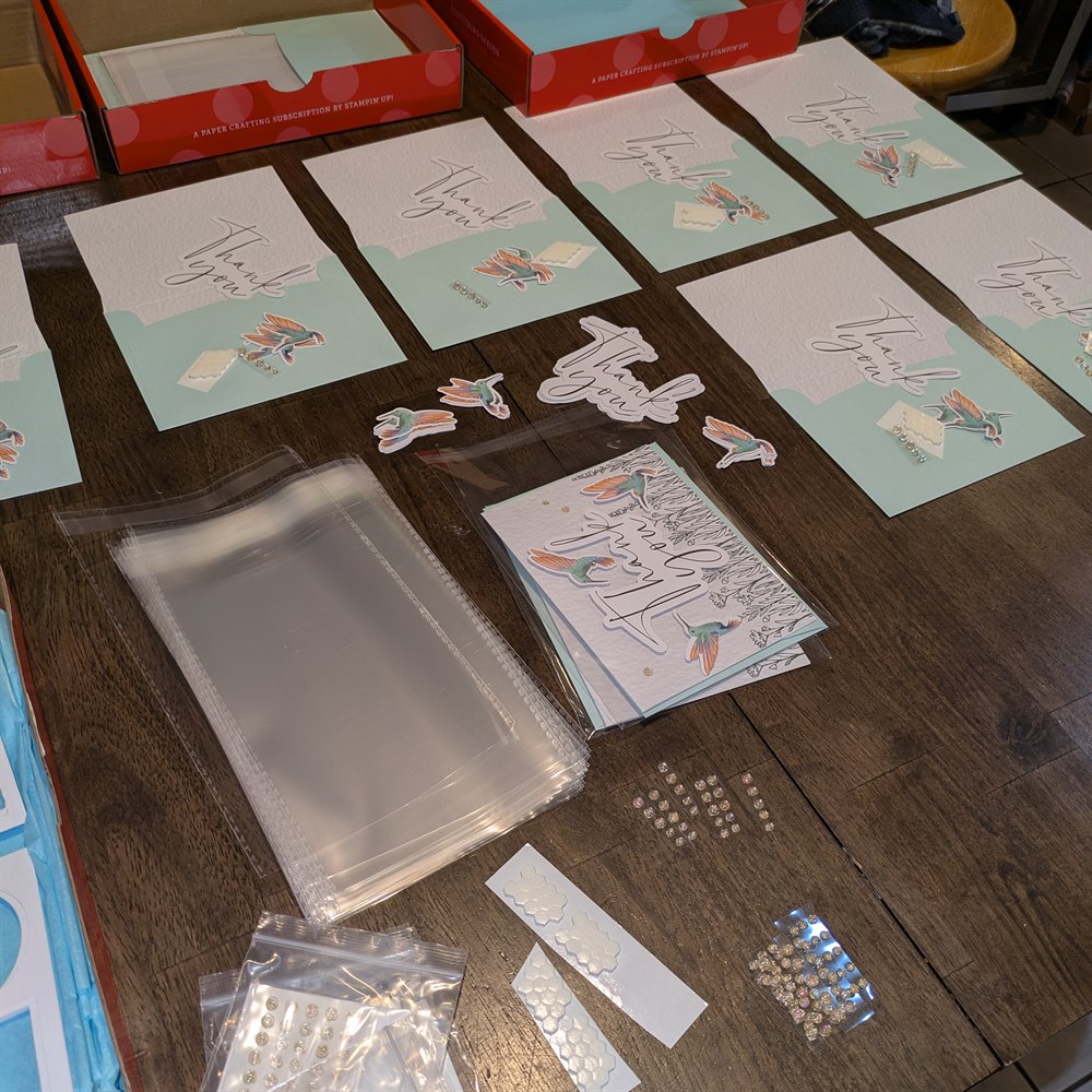 Individual card making kits laid out and ready for a class