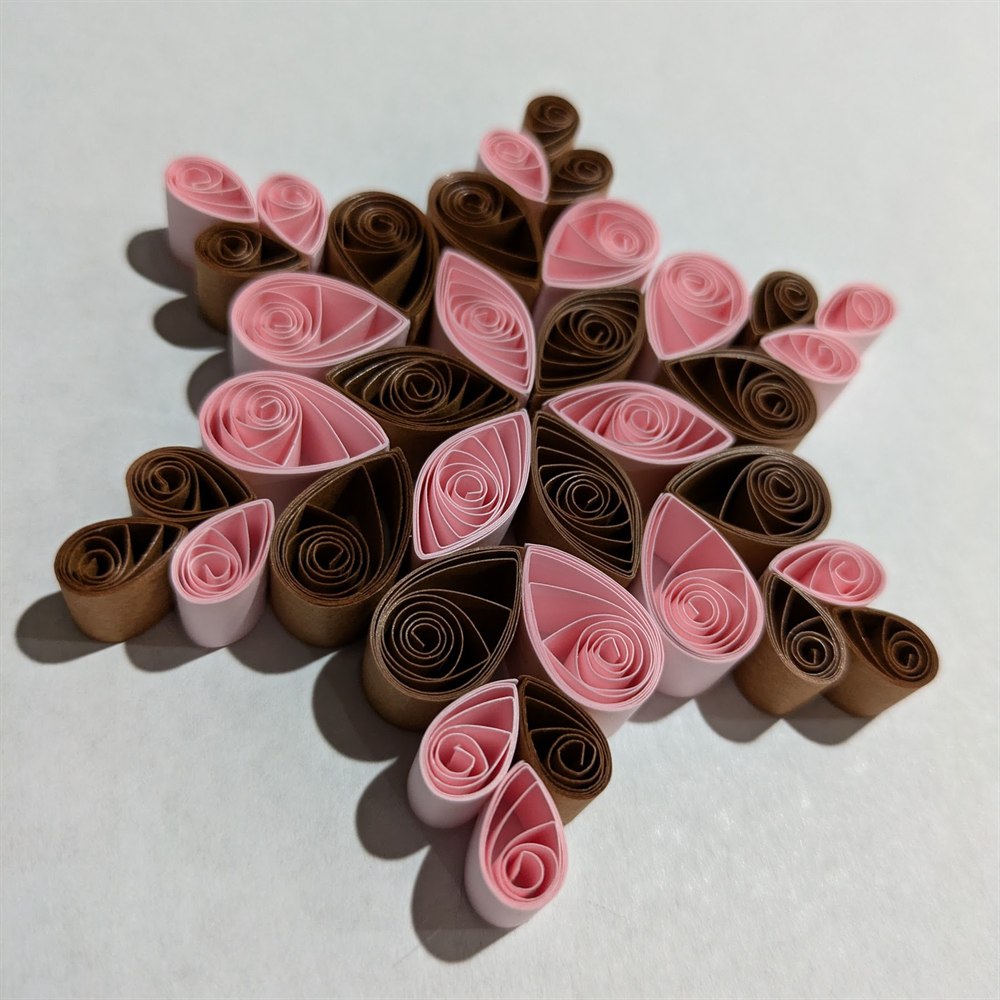 Pink and brown quilled snowflake ornament